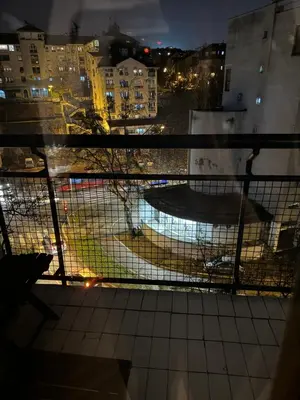 a view from a window of a city at night at Principessa Apartment in Belgrade