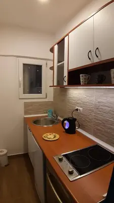 a kitchen with a sink and a counter top at Azzurro Studio Apartment in Belgrade