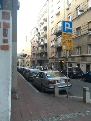 a parking sign on the side of a city street at Azzurro Studio Apartment in Belgrade