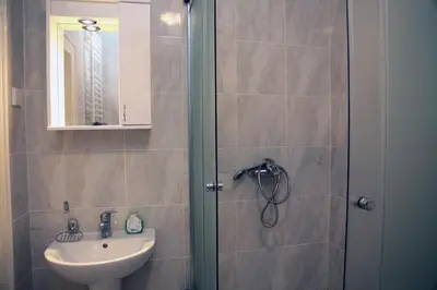 a bathroom with a shower and a sink at Petars Apartment in Belgrade
