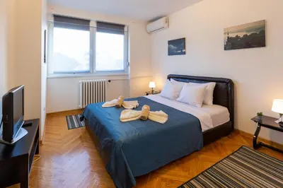a bedroom with a bed with two towels on it at King Marko Apartment (65m2) in Belgrade