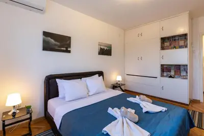 a bedroom with a bed with two towels on it at King Marko Apartment (65m2) in Belgrade