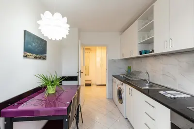a kitchen with a purple counter top and a sink at King Marko Apartment (65m2) in Belgrade