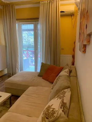 a bedroom with two beds and a window at Bellmatini in Belgrade