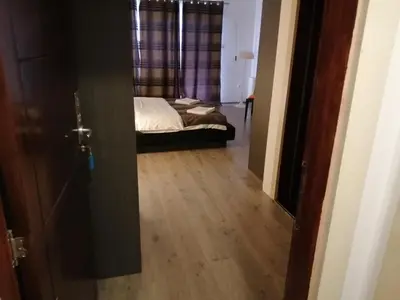 an open door to a bedroom with a bed at Bellmatini in Belgrade