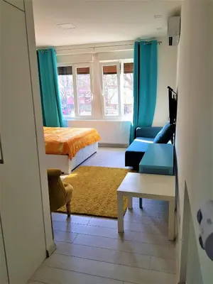 a living room with a bed and a couch at Asya Studio in Belgrade