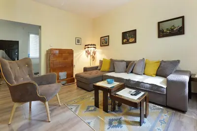 a living room with a couch and a table at Apartment Paradise Sunny Home in Belgrade