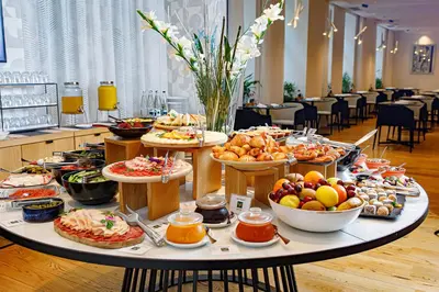 a table filled with lots of different types of food at Boutique Hotel Museum in Belgrade