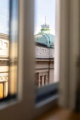 a view of a building seen through a window at Boutique Hotel Museum in Belgrade