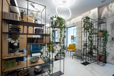 a living room with plants on the walls at Boutique Hotel Museum in Belgrade
