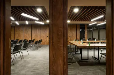 a conference room with a long table and chairs at Amsterdam Hotel in Belgrade