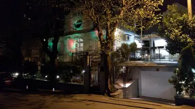a house with a gate in front of it at night at Resident hill resort in Belgrade