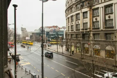 a city street with a car driving down the street at Central Apartments in Belgrade