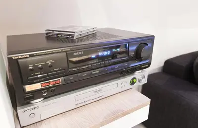 a tv sitting on top of a dvd player at Central Apartments in Belgrade