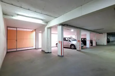 an empty parking garage with a car parked in it at Apartment Paradise Symphony in Belgrade