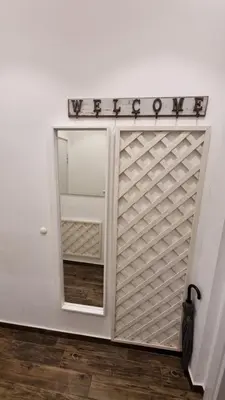 a white door with a sign that reads wiser at Al Mattina Apartments Belgrade in Belgrade