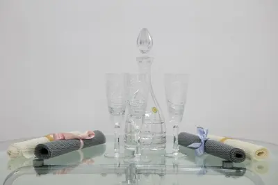 a glass table with three wine glasses on it at Natalie's Studio in Belgrade