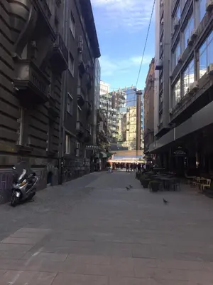 an empty street in a city with buildings at Natalie's Studio in Belgrade
