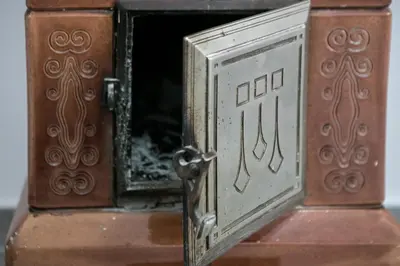 a close up of a metal door on a clock tower at Natalie's Suite in Belgrade