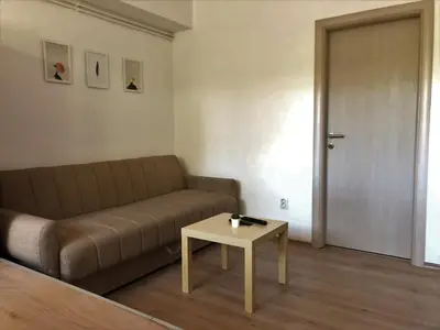 a living room with a couch and a table at Small & Sweet Apartments in Belgrade