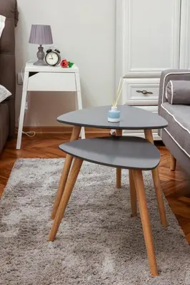 a coffee table and a stool in a living room at Natalie's Residence in Belgrade