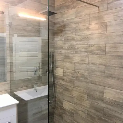a bathroom with a shower and a sink at Hearth of Belgrade apartment in Belgrade