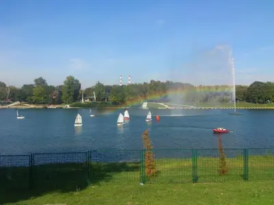 a group of sailboats on a lake with a fountain at Monia Dream Apartment - Belgrade Lake & Fair in Belgrade