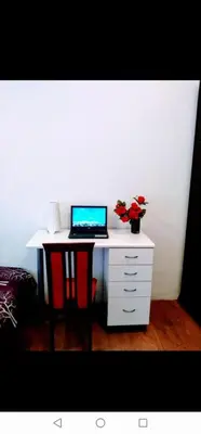 a desk with a laptop computer on top of it at Belvedere city center apartment in Belgrade
