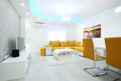 a living room with a couch and a table at Apartment Paradise SunShine in Belgrade