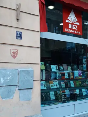 a store with a display of books in a window at Apartment Paradise SunShine in Belgrade