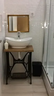a bathroom with a sink and a mirror at Cricket Park Hostel in Belgrade