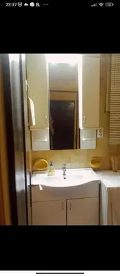 a bathroom with a sink and a mirror at Apartments Forest in Belgrade