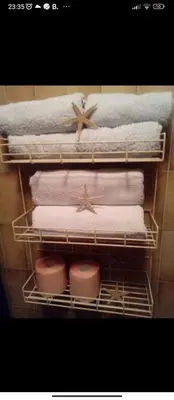 a rack of towels and towels in a bathroom at Apartments Forest in Belgrade