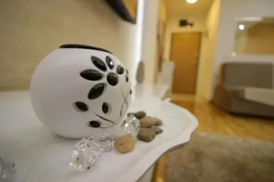 a black and white vase sitting on a table at Luna Lux Apartman in Belgrade