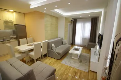 a living room with a couch and a table at Luna Lux Apartman in Belgrade