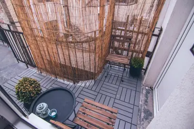 an overhead view of a patio with a table and chairs at Brigitte's Central in Belgrade