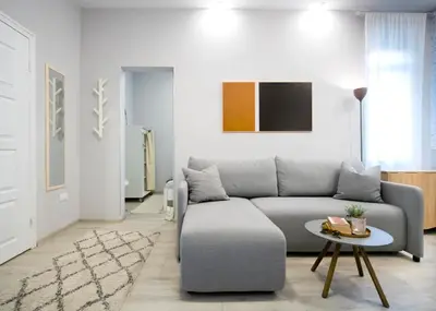 a living room with a couch and a table at Brigitte's Central in Belgrade