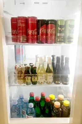 a refrigerator filled with lots of different types of drinks at Apartment Gotham in Belgrade