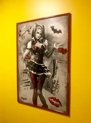 a picture of a woman in a costume on a wall at Apartment Gotham in Belgrade