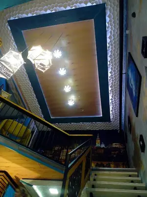 a stairway with a large mirror on the wall at NapPARK Hostel in Belgrade