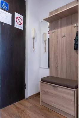 a bathroom with a bench next to a mirror at DOWNTOWN STUDIO AP in Belgrade