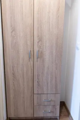 a wooden cabinet with three drawers in a room at DOWNTOWN STUDIO AP in Belgrade