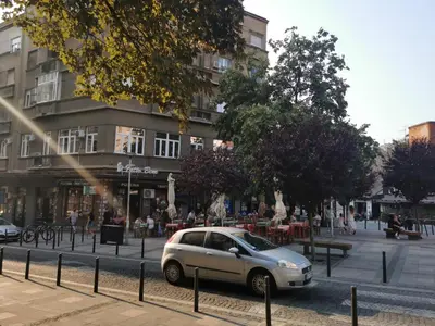 a small silver car parked in front of a building at DOWNTOWN STUDIO AP in Belgrade