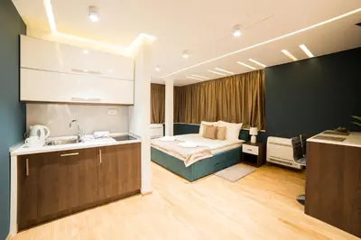 a bathroom with a bed and a sink in a room at Belgrade Center Luxury Apartments in Belgrade