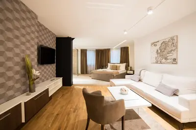 a living room with a couch and a table at Belgrade Center Luxury Apartments in Belgrade