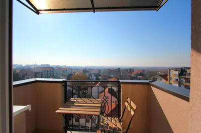 a balcony with a view of a city at Lola Almost Home in Belgrade