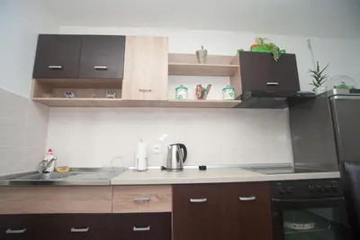 a kitchen with a sink and a counter top at Park Apartman in Arandjelovac