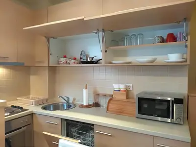 a kitchen with a microwave and a sink at Apartman Nina Vojvode Stepe Vozdovac in Voždovac