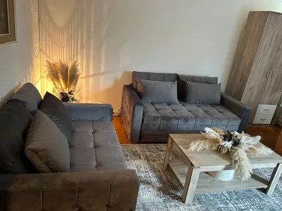 a living room with two couches and a coffee table at Beo shooping centar in Belgrade