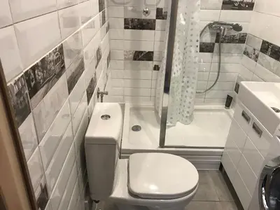a bathroom with a toilet and a shower and a sink at Lovely Apartment 2 in Belgrade